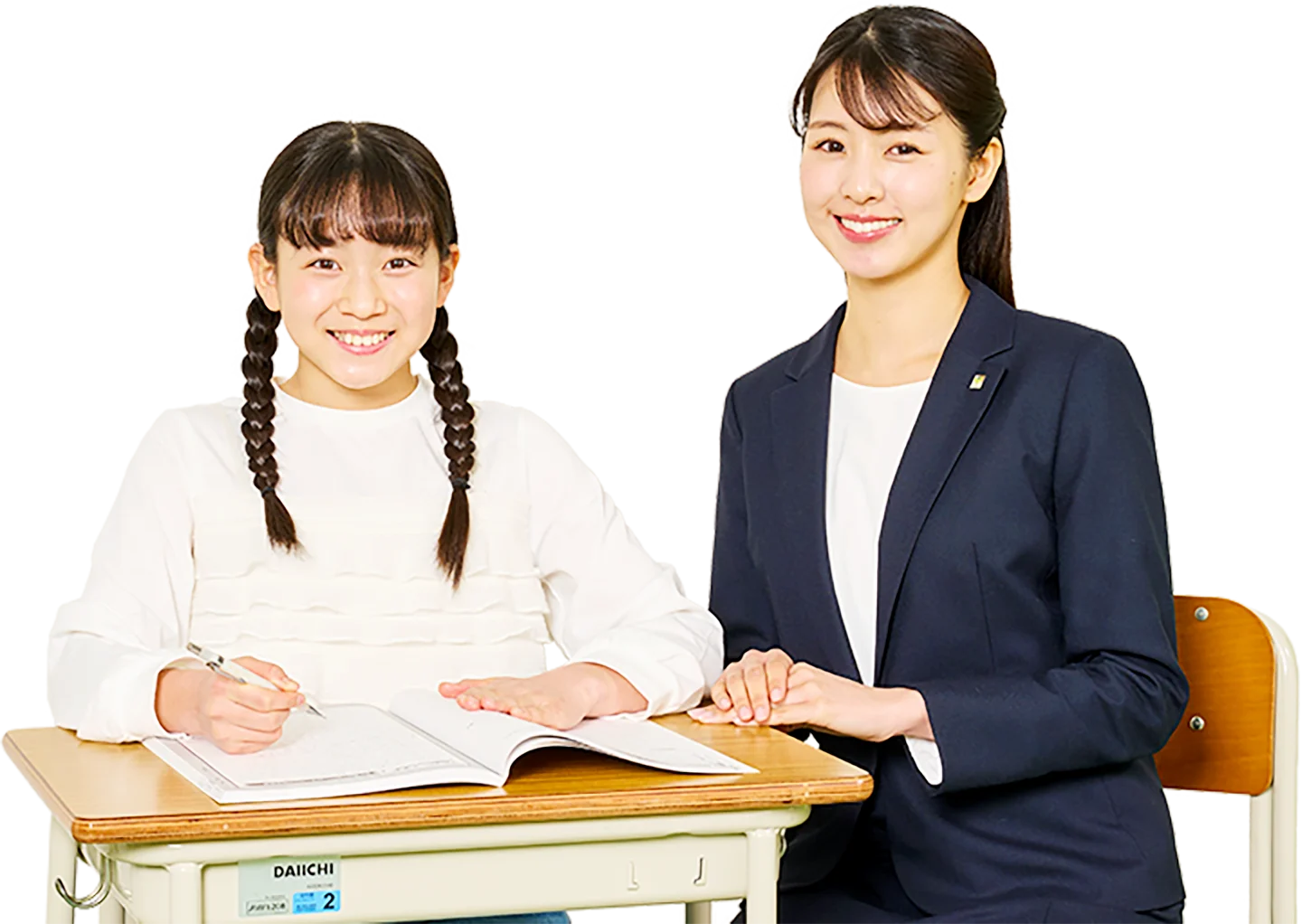 個別指導キャンパスの小学生コース。講師が生徒に寄り添い丁寧に個別指導している様子。